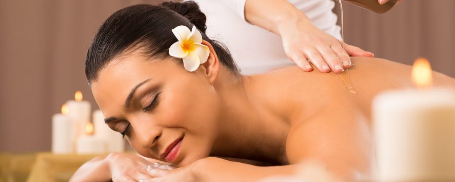 Relaxed Woman Receiving A Back Massage At Health Spa